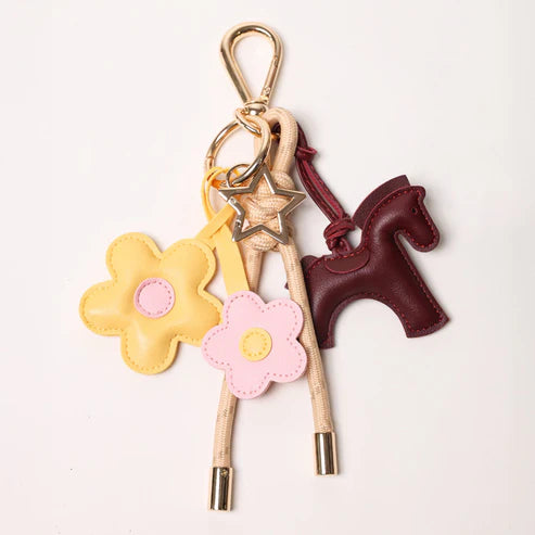 KEY CHAIN TAN WITH CHARMS | BURGUNDY HORSE AND YELLOW/PINK DAISIES